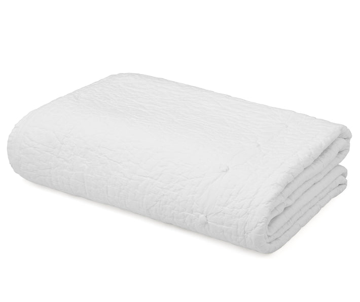 Folded white 100% cotton bedspread