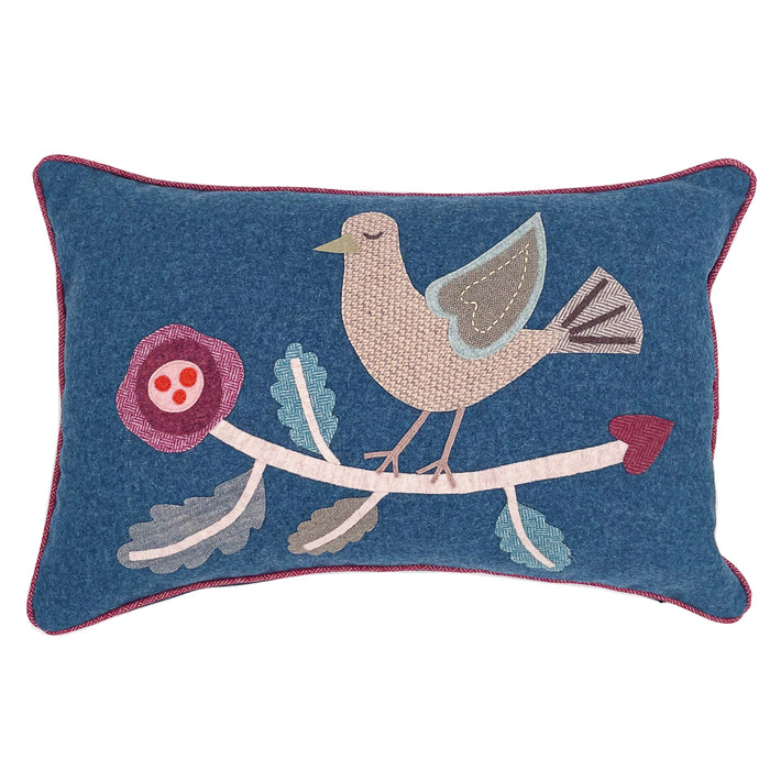 Our handmade Large Rectangular Blue Bird Cushion demonstrates the fabulous craft of hand applique and stitchwork, and is unique in nature. Made in the UK by the Kit Kemp Design Studio, this simplified Bird design takes its inspirations from folklore, utilising a collage of fabrics, on a blue wool cushion, with contrasting red wool piping, makes a delightfully quirky focal point to any room. Size 16 inches by 24 inches / 40cm by 60cm