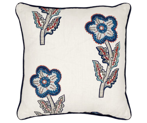 This a large 50x50 cushion with its white linen base cloth is printed with a large daisy like floral design in rich navy, pale blue and reds, and embellished with hand embroidered details, like chainstitch, and French knots, in red to add texture, with navy piping.