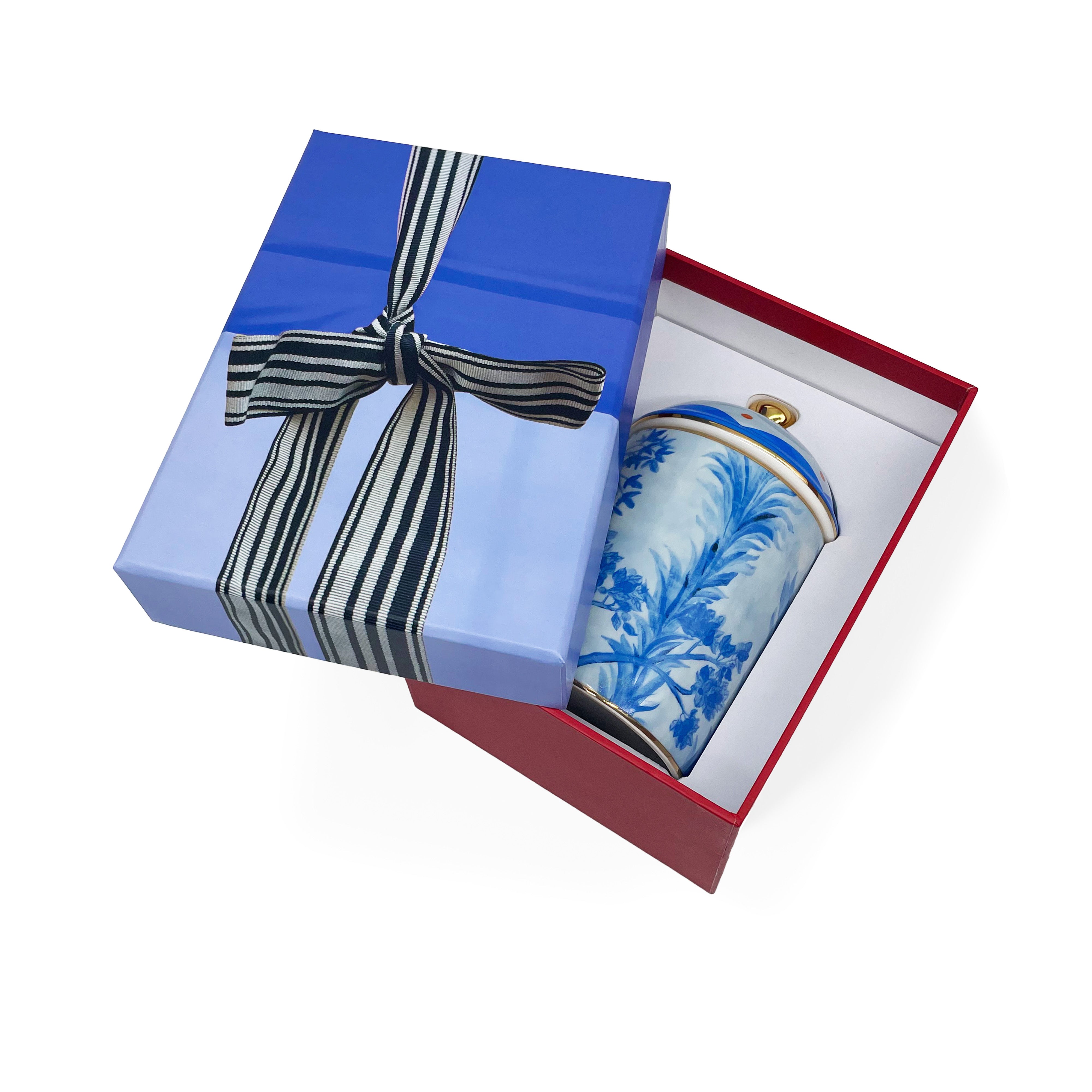 Kit Kemp Tall Trees blue and white ceramic candle with a floral pattern and a gold lid in gift box.