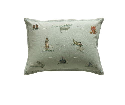 Kit Kemp for Chelsea Textiles. A rectangular hand embroidered cushion in Kit Kemp's Sailor's Farewell design. This cushion pictures the many adventures a sailor encounters when sailing away from home.