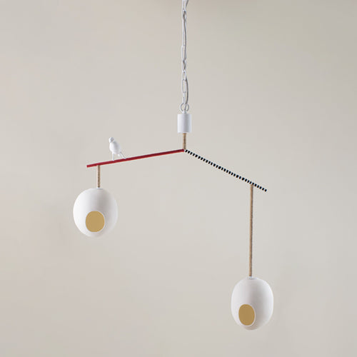 Our Cloudy Robin small suspended ceiling lamp, with a minimum drop of 0.9m. features two suspended eggs, counter balanced on a branch-like frame, softened with organic twine, with a beautifully crafted robin, standing proudly between the nest-like eggs, in white, with a monochrome, red and natural twine finished branch.