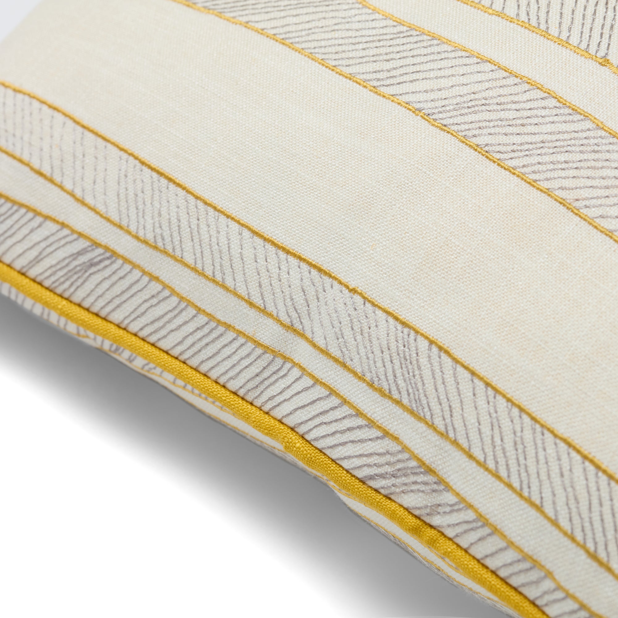 Square 41cm x 41cm (16in x 16in) Kit Kemp Design Studio cushion featuring intricate textured needlework and clean coastal lines. The cream fabric is framed by vibrant sunshine-yellow piping. Sustainably handcrafted in the UK using premium fabric offcuts from bespoke Kit Kemp design projects.