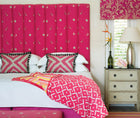 Bedroom image with cushions and headboard in pink