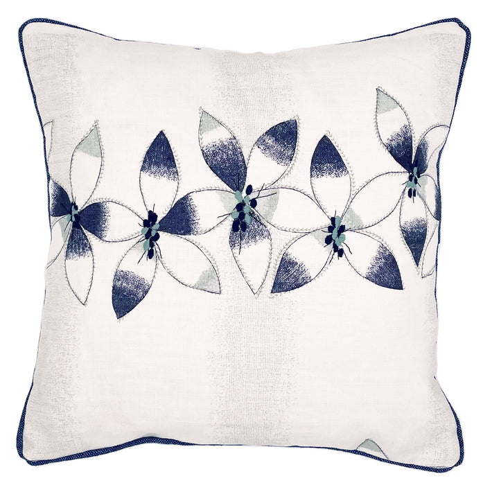 Kit's Daisy chain linen fabric is presented here as a beautiful floral cushion , with simplified flowers forming a central band of navy and soft grey, and duck-egg blue, on a ecru ground, over embroidered with navy, and duck egg detailing and contrasting navy piping. Size: 45 x 45cm