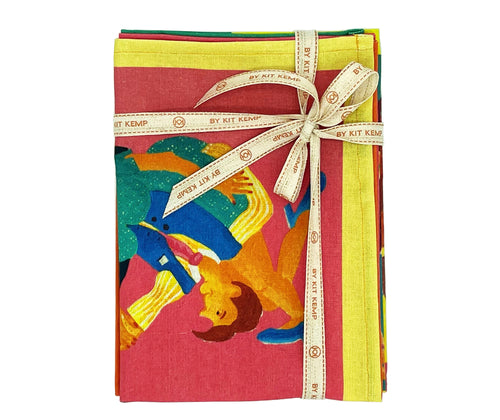 The Kit Kemp 100 % linen Tea Towels, are part of a collaboration with Ok David, The Dancers set is features acrobatic couples jiving and jitter-bugging , against brightly coloured backgrounds. Shown here folded in the stack of two and tied with the natural cotton shop kit kemp ribbon tie.