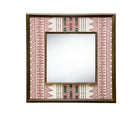 The Ethnic Embroidered Mirror, features in natural linen fabric, with broad stripes of earthy red stitchwork , with rectangular barcode-like panels in soft green, yellow and black contrasting to form an extra central design feature, stretched to form a wide decorative border around a square central mirror, in a wooden frame.