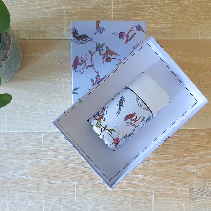 A Mug For Life, made of stainless steel and ceramic, printed with Mythical Creatures , on a pale blue background designed by Kit Kemp, presented in a gift box of the same print