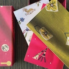 3 notebooks in three different Kit Kemp's designs for Chelsea Textiles: Friendly Flowers, Mythical Creatures and pink Moondog.