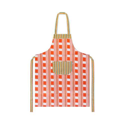 Kit Kemp's Lost and Found chequer board fabric in orange and ecru, is made into an apron with a large front pocket in orange, yellow and green stripes, is shown dressed on a green mannequin.