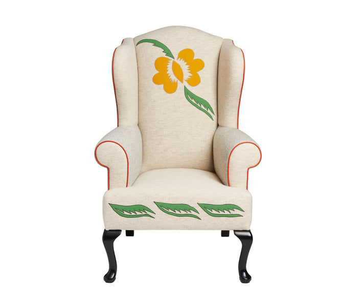 Kits Wing Chair with flower and leaf applique, front view.