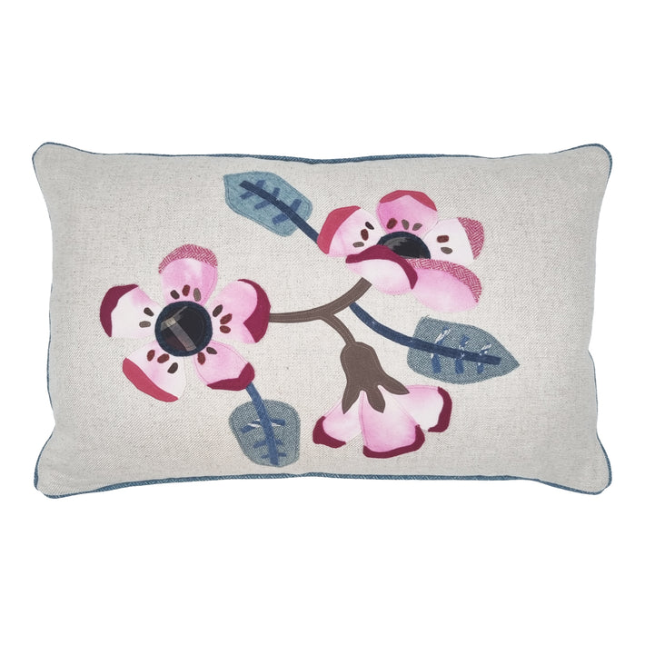 Rectangular shaped cushion with applique flowers in pink tones with plain backing and blue piping