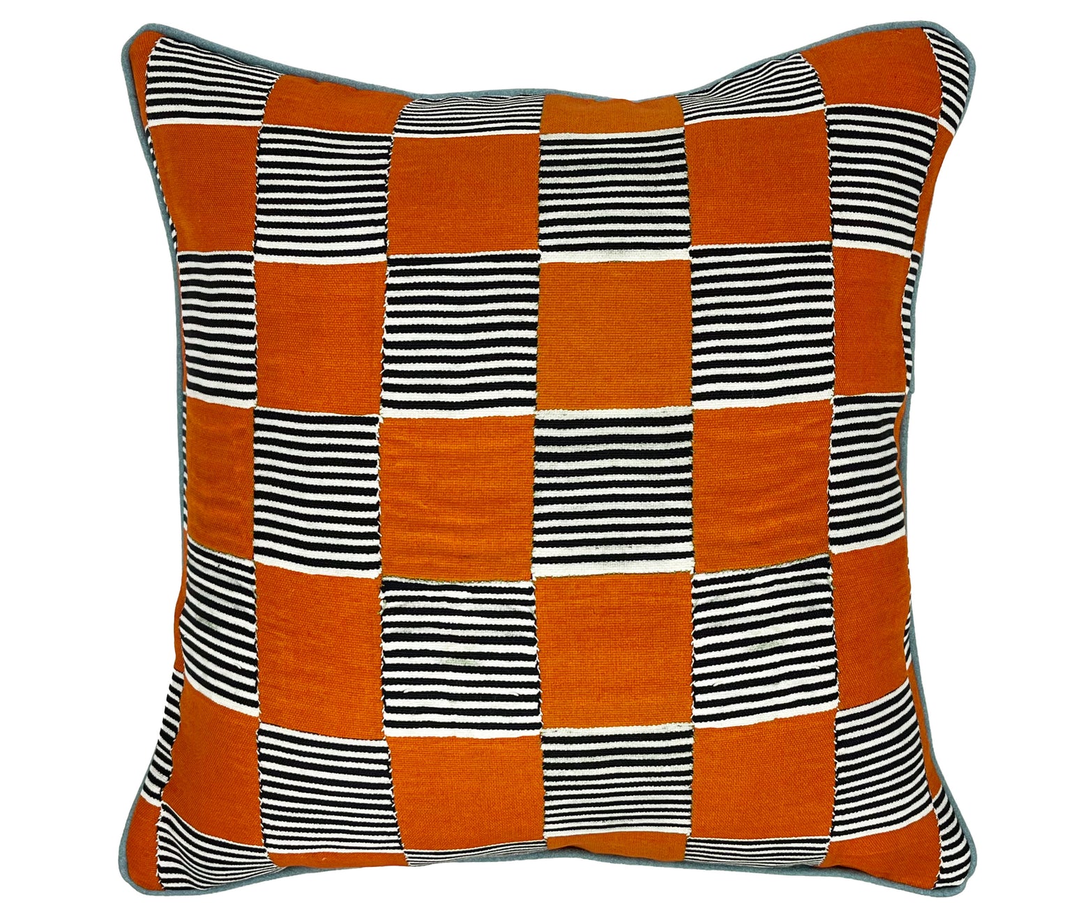 The image shows the front and back of Hot Still Scape Orange cushion. The cushion features alternating squares of orange and black-and-white striped fabric, arranged in a checkerboard pattern. The variety in texture and color between the orange and striped segments gives it a vibrant, eye-catching look. 