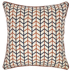 This image shows a decorative square cushion with a geometric pattern. The design features a series of interlocking lines in blue and terracotta orange, The background of the pillow appears to be off-white. The edges of the pillow are neatly finished with a piping of a red parquet fabric