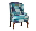 This new incarnation of Kit's Wing chair is a standout piece , upholstered in Kit's Zig Zag printed fabric from her new collection with Christopher Farr. Zig Zag's dynamic pattern intertwining abstract diamonds to give this fabric a vibrant rhythmic movement, in bold shades of turquoise and blue, its a free-moving and big statement piece.