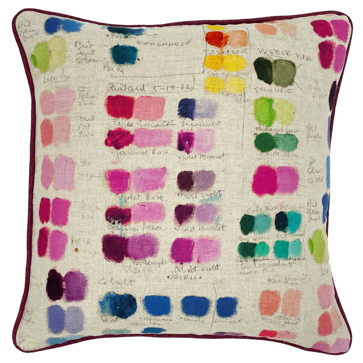 This 45cm X 45 cm cushion, is formed of a natural linen base cloth with an artists palette of colours displayed in painted rectangular forming shades of colours, going from dark to light, in pinks, jade greens, blues, purples and yellows, with the handwritten names below. Piped in burgundy herringbone wool.