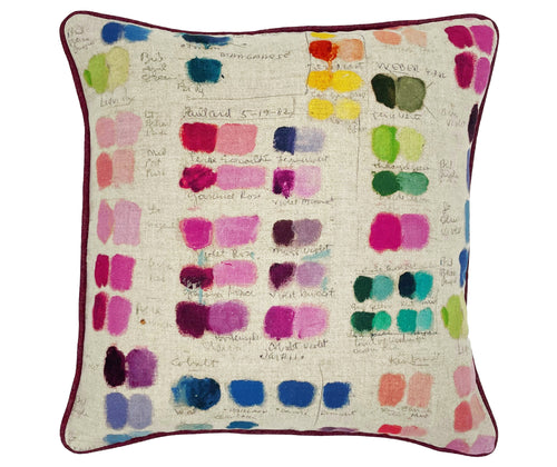 This 45cm X 45 cm cushion, is formed of a natural linen base cloth with an artists palette of colours displayed in painted rectangular forming shades of colours, going from dark to light, in pinks, jade greens, blues, purples and yellows, with the handwritten names below. Piped in burgundy herringbone wool.