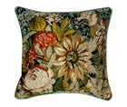 This image shows the front of the vintage needlepoint print cushion with a detailed, floral needlepoint design. The design features a variety of flowers in different colors, such as orange, white, and shades of yellow and green, set against a darker background that enhances the vibrant colors of the flowers. 