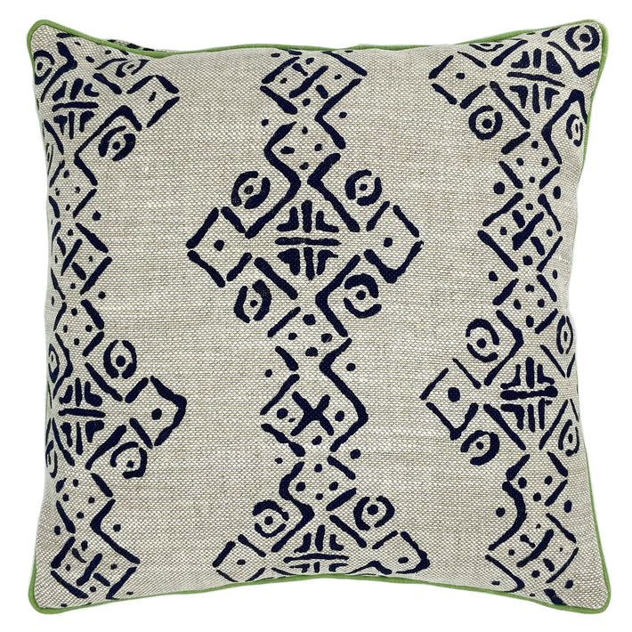 Kit Kemp's Mali fabric designed for Blithfield, in natural linen, with it's geometric indigo print, forming broad stripes of simplified diamonds, and crosses, combined with contrasting green piping, refreshes any room scheme with its clean pattern. 