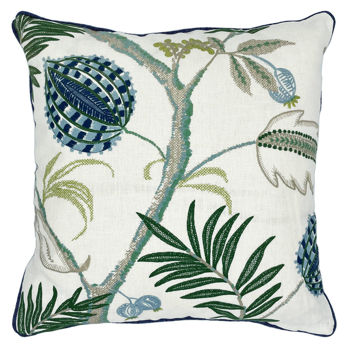 The Magalia cushion in blue is a fluid botanical design, embroidered with large jungle like leaves, and large blue seed heads, against a clean off white linen base, trimmed with blue piping and with a plain blue linen reverse: this cushion allows you to relish in this beautifully embroidered cloth. 