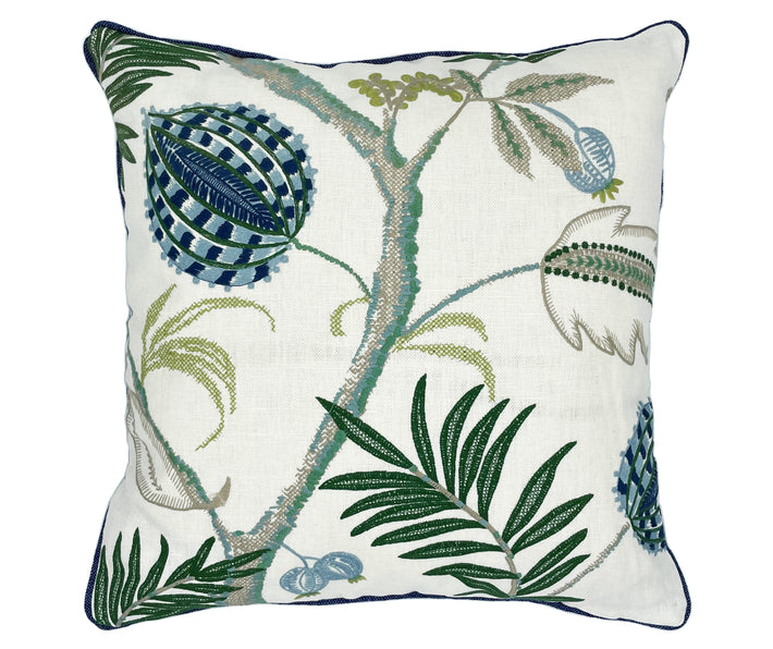 The Magalia cushion in blue is a fluid botanical design, embroidered with large jungle like leaves, and large blue seed heads, against a clean off white linen base, trimmed with blue piping and with a plain blue linen reverse: this cushion allows you to relish in this beautifully embroidered cloth. 