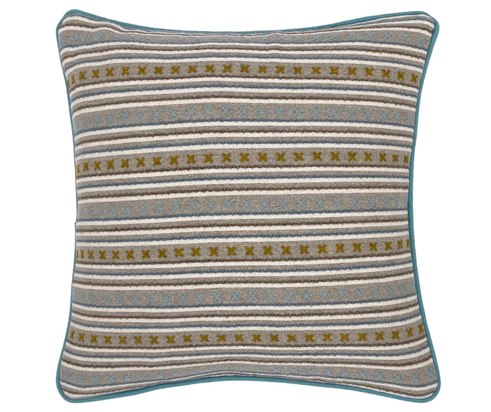 Inspired by the uneven cross stitches that join together traditional South American blankets, Kit's Criss Cross fabric, produced in collaboration with Christopher Farr, combines neat rows of stitched x's in olive green , and running stitch stripes, in tones of blue and grey wool, form repetitive multi stripe, on a base cloth of grey and white , and piped in aqua blue