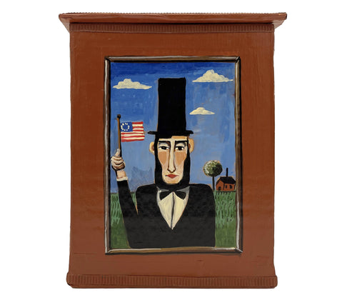 The brown President box, is decorated with a illustration Abraham Lincoln, with simple floral motifs on either side of this tall rectangular brown box, and is ideal for mementos, and keepsakes. Material : 100% paper Size:23cm x 17cm x 16cm ( Lid 17cm x 18.5cm