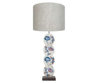 Using Kit's signature fabric design as inspirations the Psycho Sprig lamp, is hand painted by Melissa White , with its floral design of paisley like foliage curly up the 4 discs in shades of blue and pink, on an off white back ground.