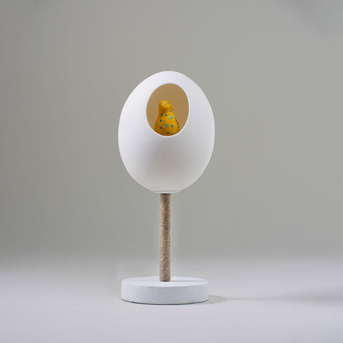 Our Funky Robin small table lamp, stands 320mm high, and features our Yellow and blue Polka dot Funky Robin sitting proudly in his glowing egg, sitting on top of a branch, softened with organic twine, in white, and makes for an inspired, and humorous table light.