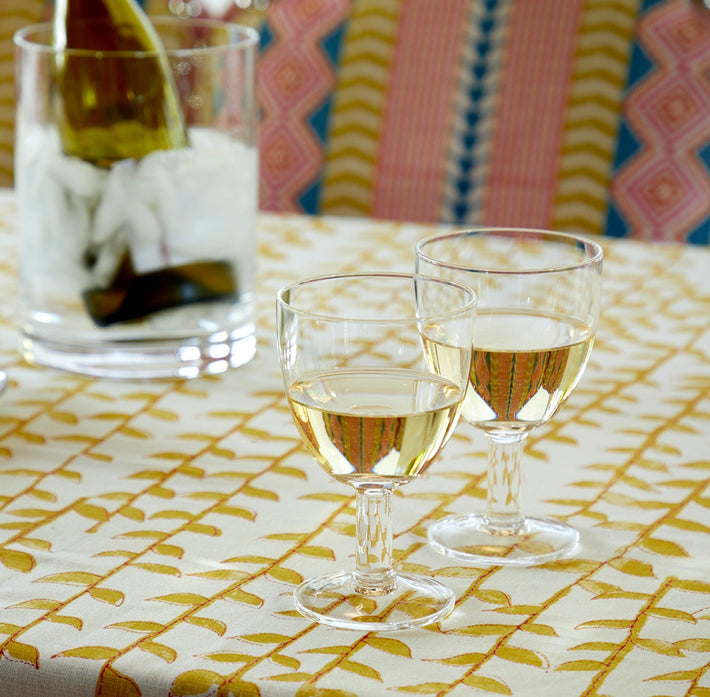 Flow glasses on yellow tealeaf table cloth