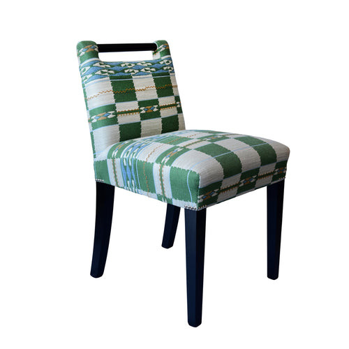 Kit Kemp's handle chair in the green Chubby Check fabric for Christopher Farr