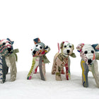 Group shot of 4 versions of the spring 2023 updated colours in Tiffany pooch, patchwork toy, standing on a white bedspread.