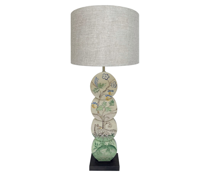 Using Kit's fabric design as inspirations the Hedgerow Quince leopard lamp, is hand painted by Melissa White, and features a grey leopard, under a fruit laden tree, in muted shades of greys, greens, blues and yellow , on a lamp base constructed out of 4 intersecting discs.