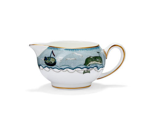 This dainty, small size cream jug, crafted in fine bone china features the whimsical sea creatures which form part of designer Kit Kempís illustrative story of The Sailorís Farewell. The two small dogs alone at sea, the whale and silvery fish are set against the pale blue finish which echoes her original fabric design. The piece is embellished with a deeper blue and hand-applied 22 carat gold trim and forms part of this novel collection,