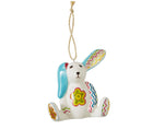 The Minnie seated rabbit ,white china ornament is inspired by Kit Kemp's patchwork toys and is decorated in bright pastel shades, with a large flower on it's belly, zig zag markings on its arms and feet , and floppy turquoise ears .