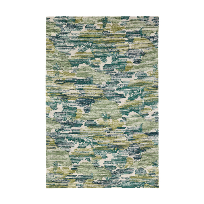 The Lady-cross rug is a hand-hooked wool rug that has an artistic interpretation of a forest trees-cape, inspired by Kit's love of the New Forest and evokes the dappled light of a forest tree-scape, in shades of green. 