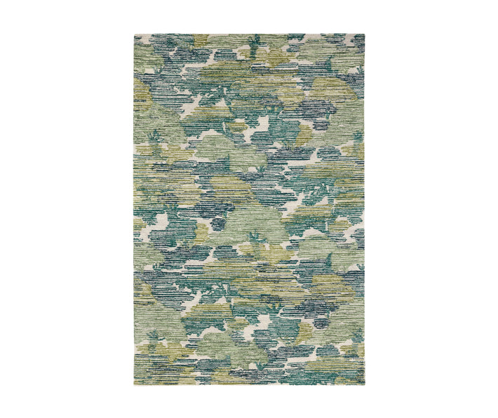 The Lady-cross rug is a hand-hooked wool rug that has an artistic interpretation of a forest trees-cape, inspired by Kit's love of the New Forest and evokes the dappled light of a forest tree-scape, in shades of green. 