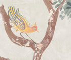 Detailed shot of the lanterns parade wallpaper in the Dawn colourway focussing and bird in a tree in shades of mellow yellows and peaches, mauve wings, against a soft green background.