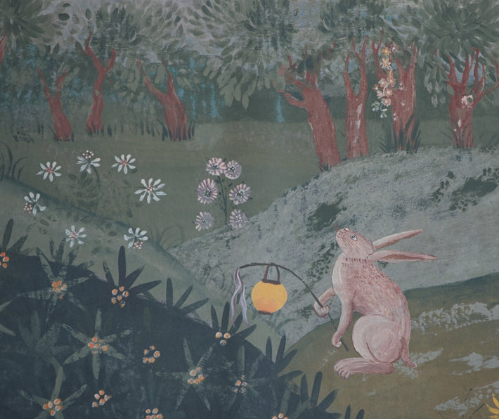 Close up shot of the lantern bearing rabbit featured in the Lantern Parade wallpaper, against green hill top background