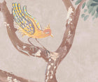 Detailed shot of the lanterns parade wallpaper in the Dusk colourway focussing and bird in a tree in shades of mellow yellows and peaches, mauve wings, against a soft pink background.