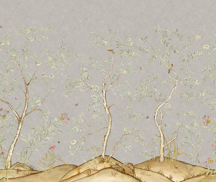 Kit's New Songbird Wallpaper, in collaboration with Andrew Martin, takes the stylised nature of Chinoiserie landscapes to a softer and more relaxed realm with an English twist. The mist colourway is suffused in the misty grey light of an english morning, where a breeze ruffles the leaves of loosely painted trees dotted with dog roses. From the delicate branches, songbirds call to each other across this serene panorama.