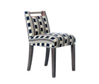 Handle Chair, upholstered in Kit Kemp for Christopher Farr 'Lost and Found' in Navy, with contrast tomato red piping; legs in 'Haymarket Grey' timber finish, with chrome studding at the top of the leg