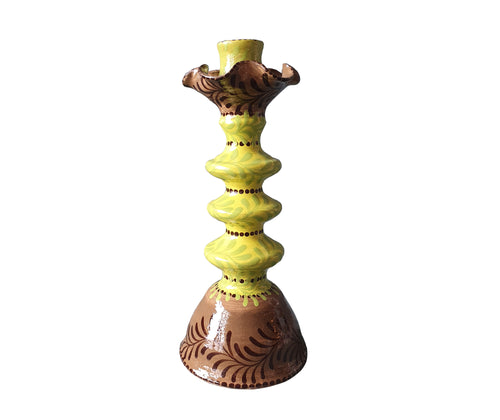 Katrin Moye's Garland Stripe candlestick, with its fluted collar, in lime and chocolate brown is hand painted with green foliage, is a colourful addition to any mantle piece or table setting. Size: H: 23.5cm Diameter: Base: 10cm Material: Glazed Earthenware.