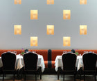 Picture of 2 tables in Ham Yard Hotel with table cloth by a white wall