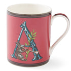 A red ceramic mug with the Initial letter A, in blue, forming a resting point for our, trumpet carrying hare, with green leaf sprig detail, red handle, and white interior. The design appears on both sides of the mug.