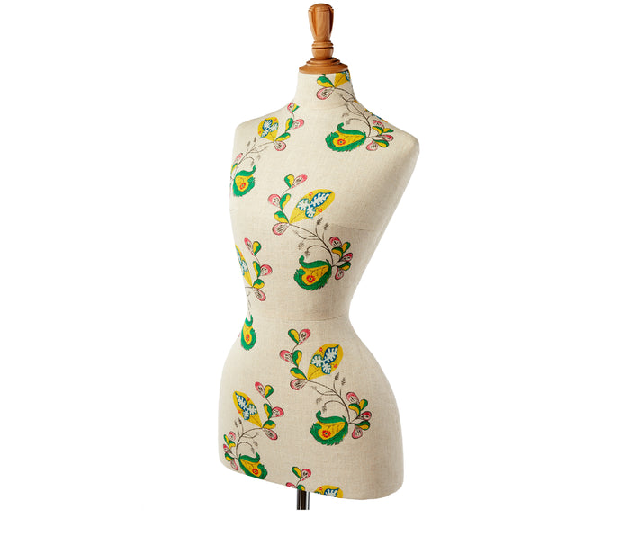 Front side view of mannequin with Psycho Sprig, Tropical Yellow fabric. The design shows vibrant yellow, pink and green curled vines