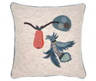 The hand appliqued Mythical Bird, in assorted shades of light blue cloth, is sewn onto a ecru wool 50x50cm cushion, next to a hanging pear, formed of orange herringbone wool.