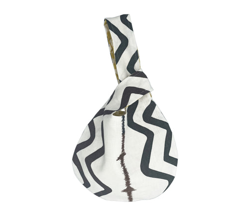 The Rick Rack Loop bag , is created from Rick Rack, one of Kits signature zig zag fabric designs in a monochrome palette, with embroidered radio frequency stripe in shades of brown. Combined with assorted contrasting inners in either yellow or aqua shades, to achieve this unique occasional bag. 