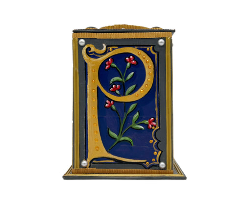 This blue and grey alphabet box is decorated with a purple letter P in a heraldic decorative style, with a red floral motif and embellished with a blue and grey jewelled lid. 