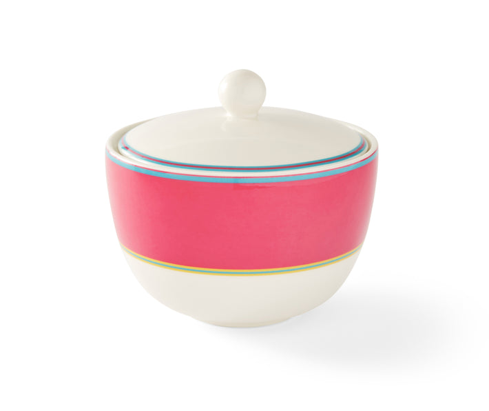 The Calypso Pink Covered Sugar Bowl has a simple domed shape with its wide pink band, bordered by narrow stripes in blue and yellow, and topped with a elegantly simple white lid, and adds a touch of colour to your breakfast table.